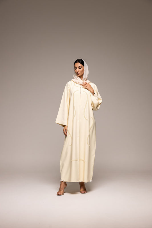 Elegance in Ivory: A Modern Twist on Traditional Abaya Fashion
