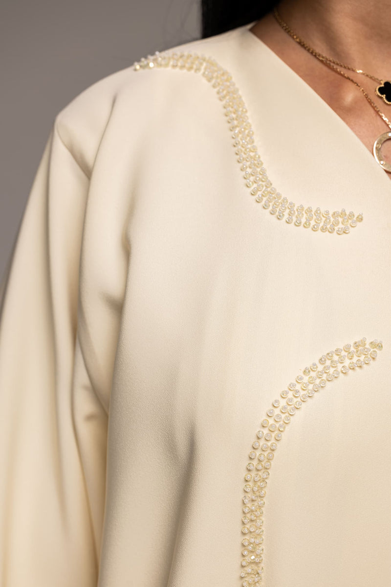 Elegance in Ivory: A Modern Twist on Traditional Abaya Fashion