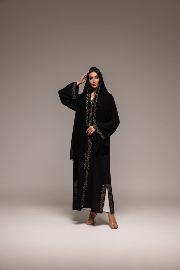 Sable Sophistication: Majestic Black Abaya with Golden Ornate Accents