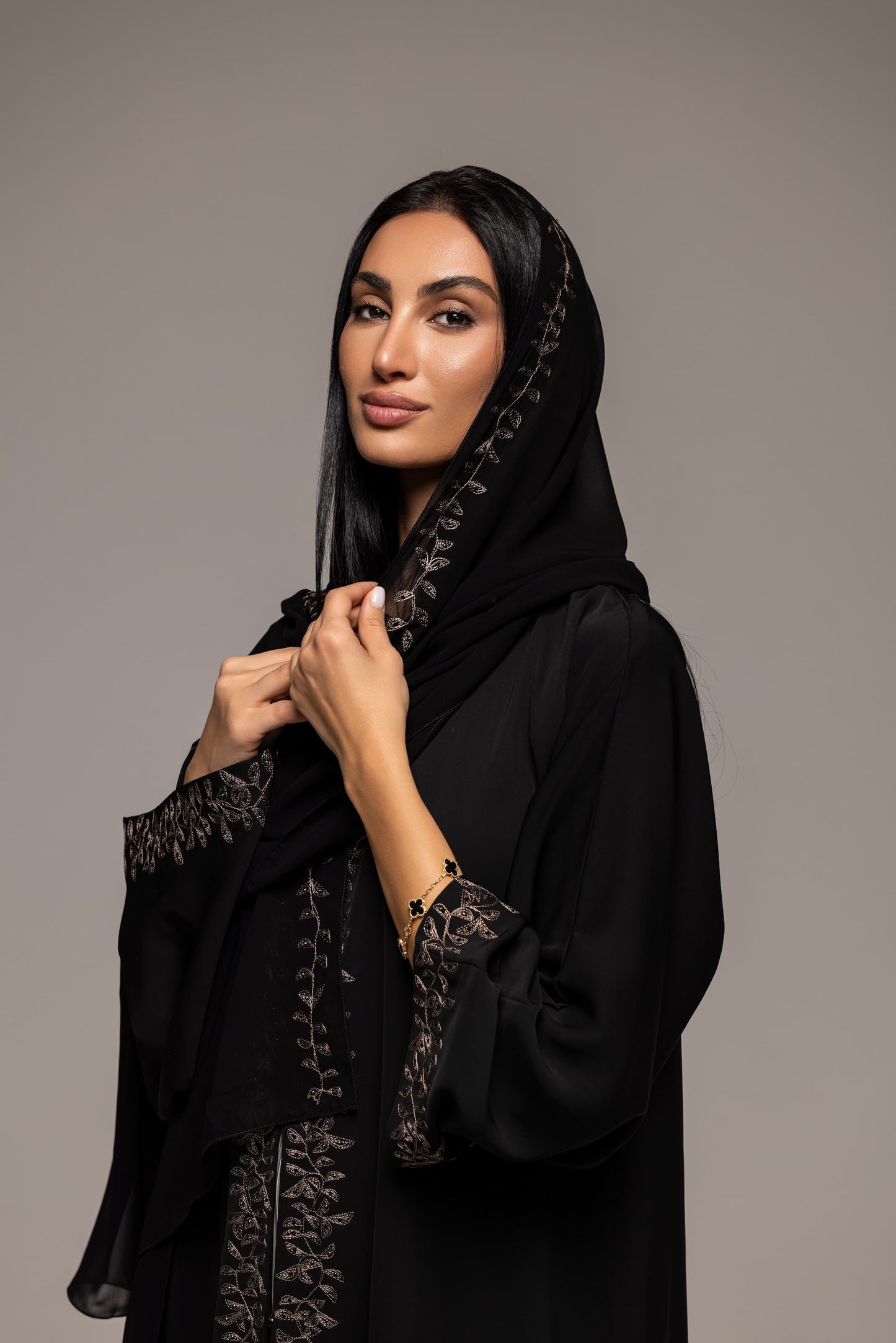 Sable Sophistication: Majestic Black Abaya with Golden Ornate Accents