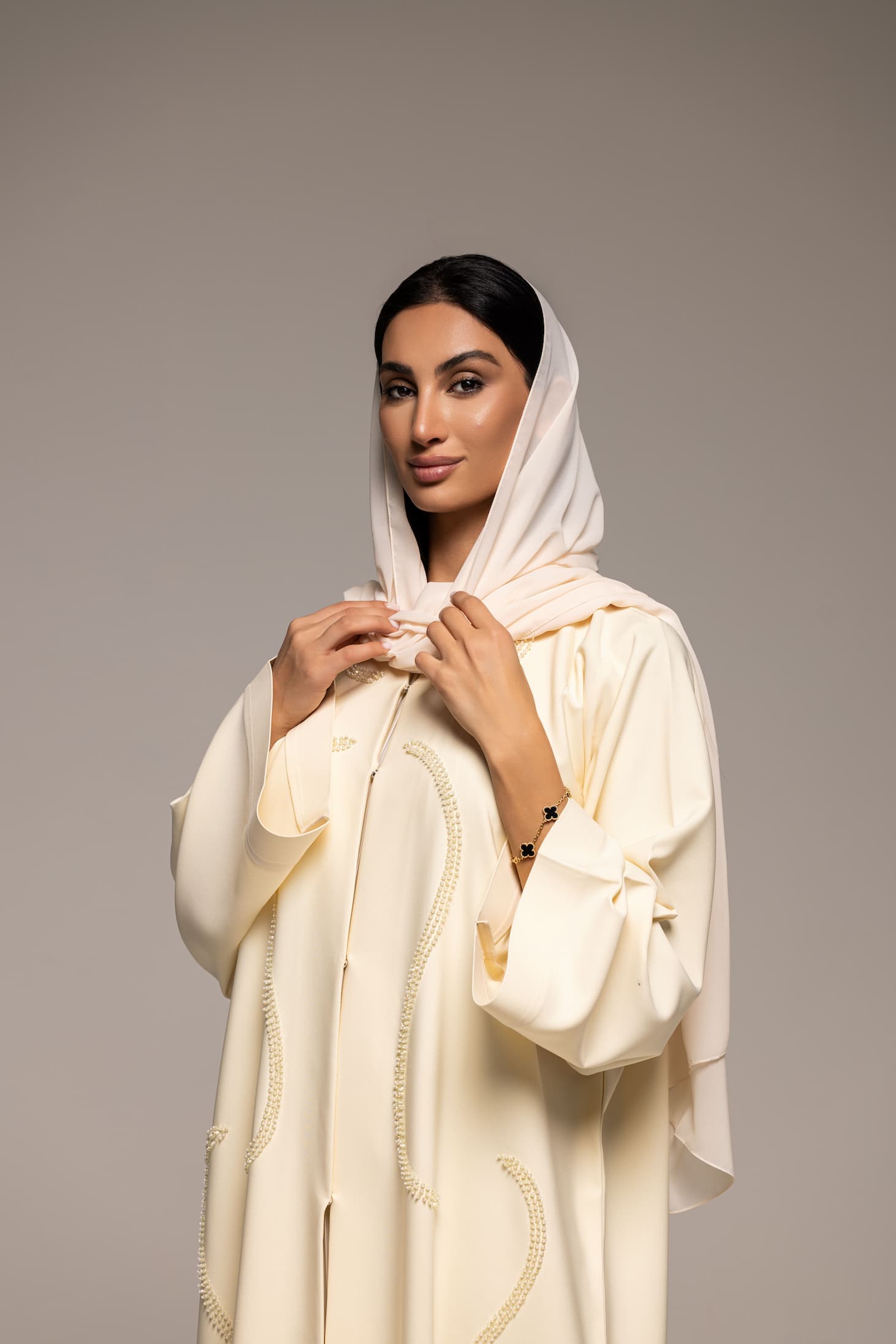 Elegance in Ivory: A Modern Twist on Traditional Abaya Fashion